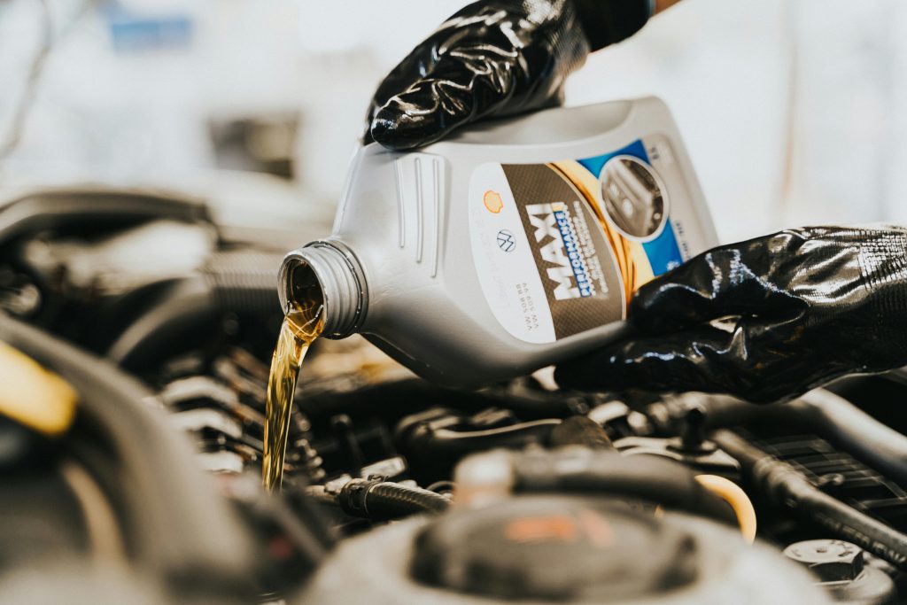 Close-up of new motor oil being added to a vehicle at 7 Force Garage Sheffield.